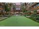 Lovely condo grounds featuring a manicured putting green, water features, and surrounded by lush landscaping at 7137 E Rancho Vista Dr # 2010, Scottsdale, AZ 85251