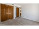 Bedroom features wood closet doors at 7530 E North Ln, Scottsdale, AZ 85258