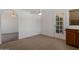 Eat-in kitchen area with backyard access and view of the dining room at 7530 E North Ln, Scottsdale, AZ 85258