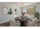 Cozy dining room with stylish chandelier, table setting, and natural light at 7530 E North Ln, Scottsdale, AZ 85258