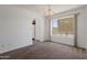 Bright dining area featuring a large window and neutral decor at 7530 E North Ln, Scottsdale, AZ 85258