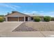 Charming single-story home featuring a two-car garage and low maintenance landscaping at 7530 E North Ln, Scottsdale, AZ 85258