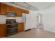 Functional kitchen featuring stainless steel appliances and ample cabinet space at 7530 E North Ln, Scottsdale, AZ 85258