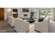 Inviting living room featuring contemporary furniture, fireplace, and pool access at 7530 E North Ln, Scottsdale, AZ 85258