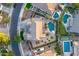 Aerial view of a landscaped backyard with pool, street, and neighborhood at 8500 W Nicolet Ave, Glendale, AZ 85305