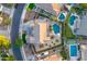 Aerial view of a backyard with a pool, spa, and lush landscaping at 8500 W Nicolet Ave, Glendale, AZ 85305