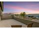 Private balcony with wrought iron railing offers panoramic views of a colorful sunset sky at 8500 W Nicolet Ave, Glendale, AZ 85305