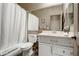 Standard bathroom featuring a shower-tub combo, toilet, and vanity with a mirror at 8500 W Nicolet Ave, Glendale, AZ 85305