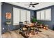 Cozy dining area featuring wood table, four chairs, and natural light from the windows at 8500 W Nicolet Ave, Glendale, AZ 85305