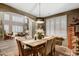 Comfortable dining area featuring a rustic table, seating for six, and lots of natural light at 8500 W Nicolet Ave, Glendale, AZ 85305