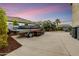 Long driveway features a covered boat, mature trees, and an outdoor condenser at 8500 W Nicolet Ave, Glendale, AZ 85305