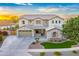 Inviting two-story home exterior with a well-manicured lawn at 8500 W Nicolet Ave, Glendale, AZ 85305