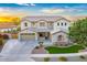 Charming two-story home with a well-manicured front yard and tasteful stone accents at 8500 W Nicolet Ave, Glendale, AZ 85305