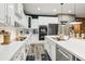 A well-equipped kitchen features white cabinets, stainless appliances, and spacious countertops at 8500 W Nicolet Ave, Glendale, AZ 85305