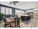 Bright kitchen features a center island with seating, white cabinets, and stainless-steel appliances at 8500 W Nicolet Ave, Glendale, AZ 85305