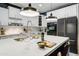 Modern kitchen features a large island, stainless steel appliances, and white cabinetry at 8500 W Nicolet Ave, Glendale, AZ 85305