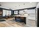 Modern kitchen features a large island, stainless steel appliances, and a breakfast bar at 8500 W Nicolet Ave, Glendale, AZ 85305