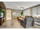 Spacious living room featuring recessed lighting, neutral walls, and a cozy grey sofa at 8500 W Nicolet Ave, Glendale, AZ 85305