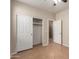 Bedroom featuring a closet with sliding doors and tile flooring at 8848 W Cordes Rd, Tolleson, AZ 85353