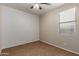 A cozy bedroom with a ceiling fan and a window providing natural light at 8848 W Cordes Rd, Tolleson, AZ 85353