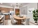 Dining area with wood table, modern chairs, updated cabinets, and natural light at 8848 W Cordes Rd, Tolleson, AZ 85353
