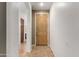 Welcoming entryway featuring neutral-toned tile flooring, an inviting front door, and arched openings to other rooms at 8848 W Cordes Rd, Tolleson, AZ 85353