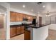 Spacious kitchen showcasing stainless steel appliances, black countertops, and a breakfast bar for casual dining and entertaining at 8848 W Cordes Rd, Tolleson, AZ 85353