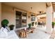 Outdoor patio space with comfortable seating and a dining area for relaxed entertaining at 8848 W Cordes Rd, Tolleson, AZ 85353