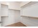 Spacious walk-in closet with built-in shelving and ample storage space at 8848 W Cordes Rd, Tolleson, AZ 85353