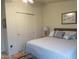 Well-lit bedroom with neutral paint, a fan, and plush bedding at 9302 E Broadway Rd # 157, Mesa, AZ 85208