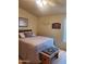 Bedroom with neutral walls, a ceiling fan, and plush bedding at 9302 E Broadway Rd # 157, Mesa, AZ 85208