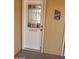 A charming front door with a welcoming 'Inlaws & Outlaws Welcome' message at 9302 E Broadway Rd # 157, Mesa, AZ 85208