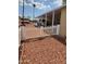 Charming front yard featuring decorative rock landscaping, white picket fence, and covered parking at 9302 E Broadway Rd # 157, Mesa, AZ 85208