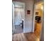 Hallway view of bathroom and office space, showcasing interior flow and neutral colors at 9302 E Broadway Rd # 157, Mesa, AZ 85208
