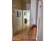 Inviting hallway with hardwood floors leading to a bright and open living space at 9302 E Broadway Rd # 157, Mesa, AZ 85208