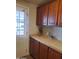 Bright area with upper and lower cabinets and spacious countertop workspace at 9302 E Broadway Rd # 157, Mesa, AZ 85208