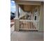A charming covered front porch with white railings, chairs and desert landscaping at 9302 E Broadway Rd # 157, Mesa, AZ 85208