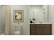Neutral bathroom featuring a shower, toilet and sink at 9526 W Catalina Dr, Phoenix, AZ 85037