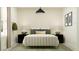 Inviting bedroom featuring a plush, upholstered bed, contemporary bedside tables, and chic decor elements at 9526 W Catalina Dr, Phoenix, AZ 85037