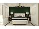 This bedroom features a patterned accent wall, modern decor, and ample space at 9526 W Catalina Dr, Phoenix, AZ 85037