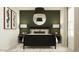 This bedroom boasts a black bed frame, stylish lighting, and contemporary wall decor for a modern aesthetic at 9526 W Catalina Dr, Phoenix, AZ 85037