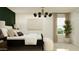 Spacious bedroom showcasing neutral tones, a stylish light fixture, and large windows at 9526 W Catalina Dr, Phoenix, AZ 85037