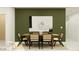 This dining room features an accent wall and modern decor at 9526 W Catalina Dr, Phoenix, AZ 85037