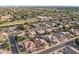 Wide angle aerial view of a residential area showcasing various homes and lush greenery at 1015 E Constitution Dr, Gilbert, AZ 85296