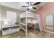 Stylish bedroom with loft bed, desk area, and fun storage solutions at 1015 E Constitution Dr, Gilbert, AZ 85296