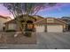 Charming two-story home with a three-car garage and desert landscaping at 1015 E Constitution Dr, Gilbert, AZ 85296
