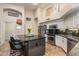 Contemporary kitchen featuring stainless steel appliances, a center island with seating, and ample counter space at 1015 E Constitution Dr, Gilbert, AZ 85296