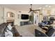 Spacious living room featuring a cozy fireplace, entertainment center, and comfortable leather seating at 1015 E Constitution Dr, Gilbert, AZ 85296