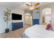 Spacious main bedroom with ensuite bath access and large TV at 1015 E Constitution Dr, Gilbert, AZ 85296