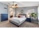 Serene main bedroom featuring vaulted ceilings, a ceiling fan, and an ensuite bathroom at 1015 E Constitution Dr, Gilbert, AZ 85296